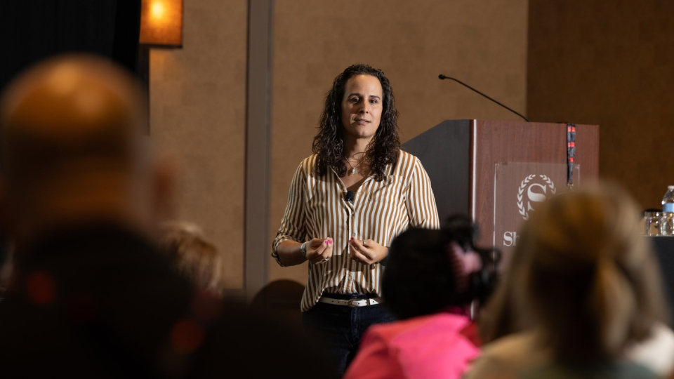 Image of keynote speaker, identity coach and author Don Mamone coaching an event industry professional at the NACE National Experience Conference in Dallas, TX captured by Emily Mamone, The Mamones LLC